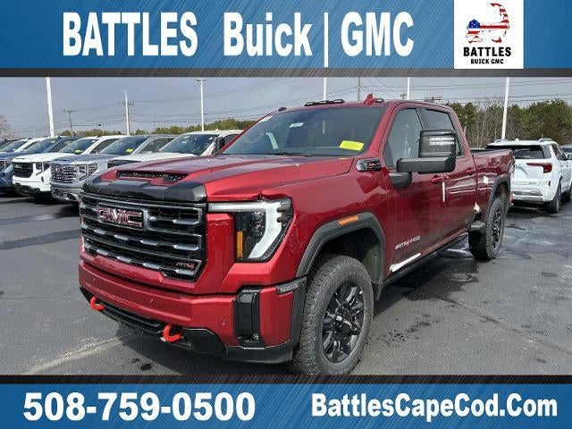 2026 GMC Sierra 2500 HD AT4 in Volcanic Red Tintcoat — front three-quarter view